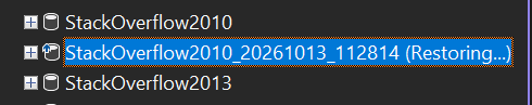 SSMS Object Explorer showing the restored database with the status Restoring.